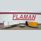 Photo of Flaman trailers parked in snow