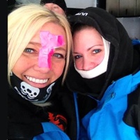 Stephanie Schwartz and Darcie Downy with duct tape on their faces to fend off the cold.