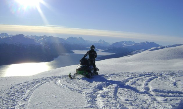 A snowmobiler overlooking a lake in Houston.