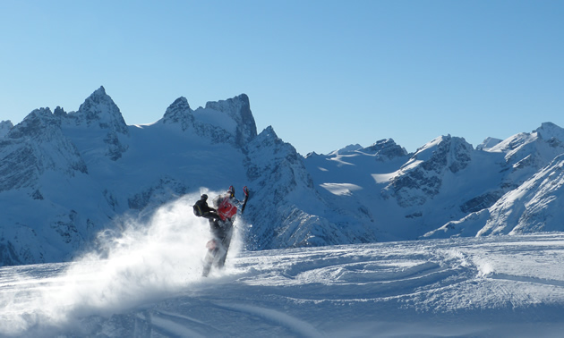 Snowmobiler hitting a wind lip in Radium.