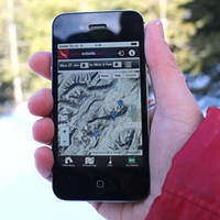 Photo of someone holding an iPhone displaying the new app upgrade to help improve avalanche forecasting