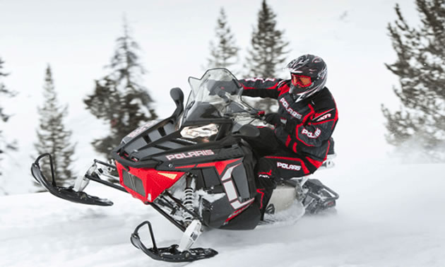 Photo of a rider on a Polaris snowmobile.