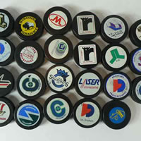 Photo of an assortment of hockey pucks