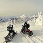 two snowmobiles
