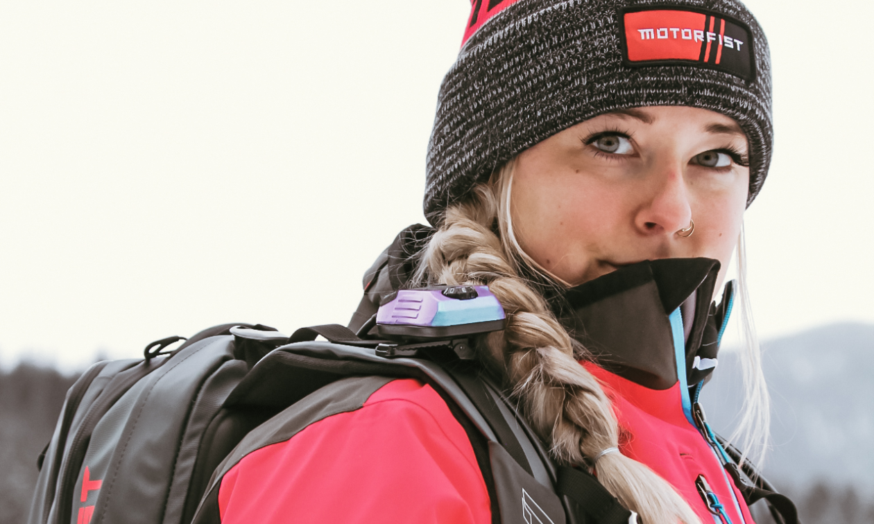 Angel Sterling has braided hair and wears a pink jacket and grey toque. 