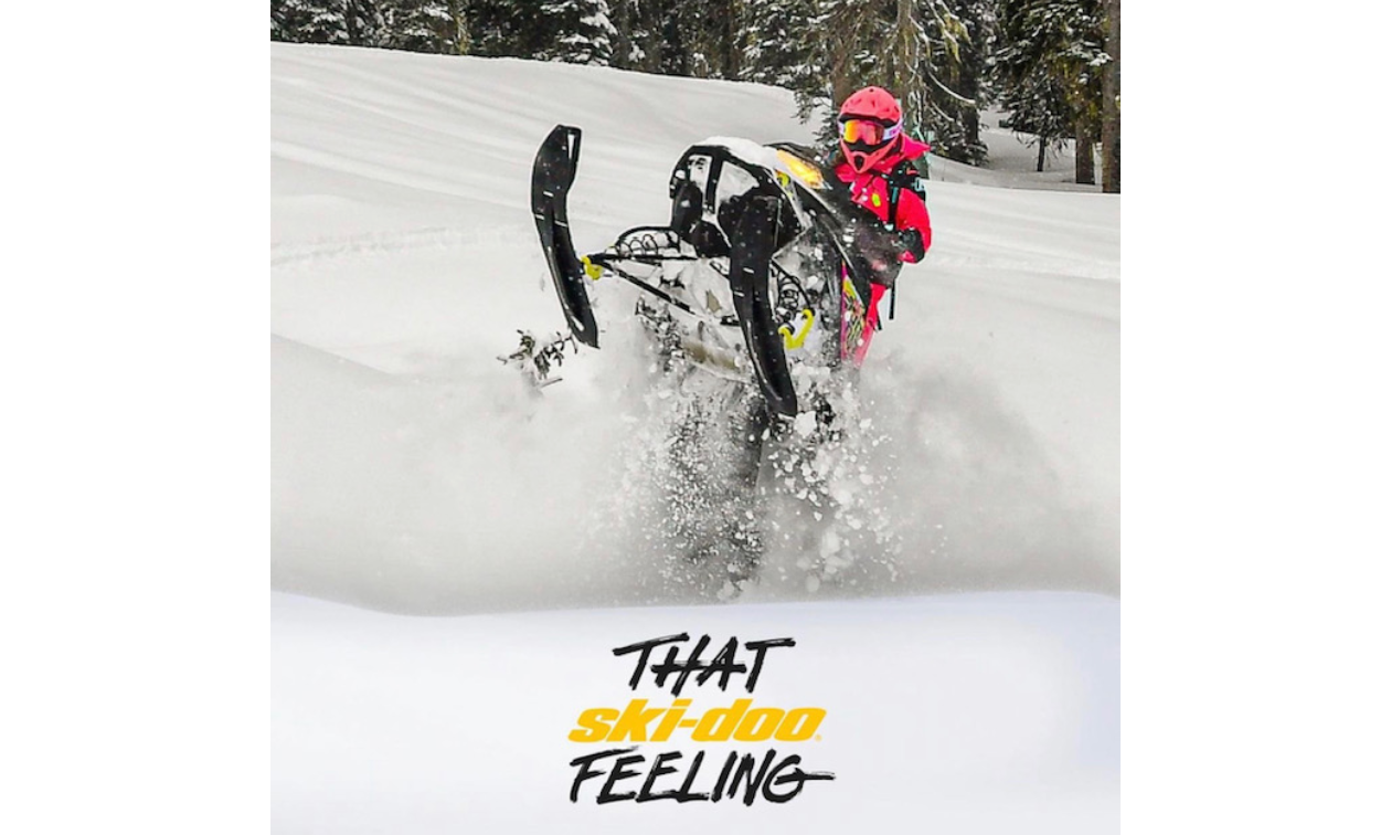 Jenny Hashimoto-Wiebe does a wheelie on a snowmobile. 