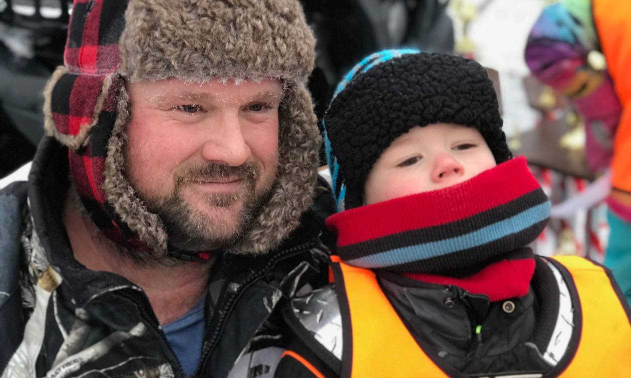 Tom and Cruz Audette pose with a trophy in frigid conditions. 