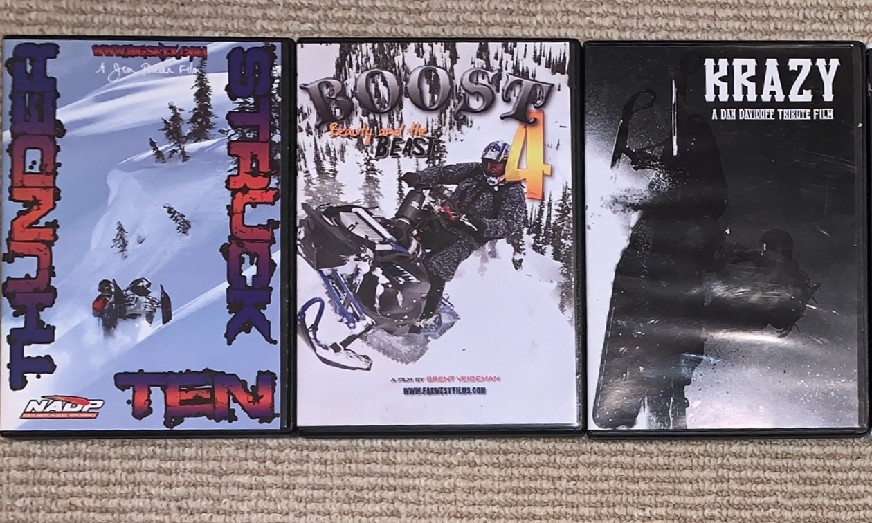 Snowmobiling DVDs are pictured: Thunderstruck, Boost 4 and Krazy: A Dan Davidoff Tribute Film. 