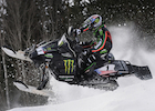 Tucker Hibbert riding a snowmobile.