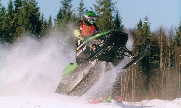 A woman on snocross. 