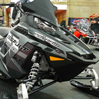 A black Polaris snowmobile. 