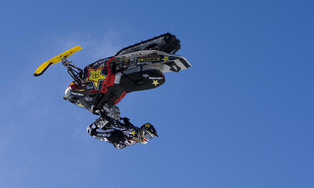 Caleb Moore doing a kiss of death stunt on snowmobile. 