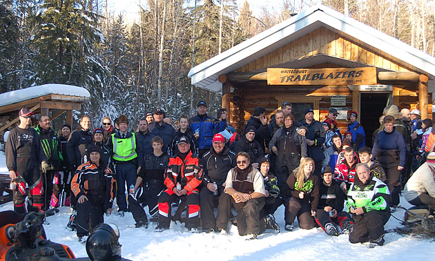 A group of people pose outdoors for a picture at the sixth annual VIP & Media Ride in Whitecourt, AB