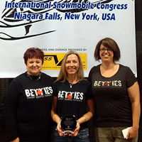 Donegal Wilson and two other ladies from the Betties Power Sports Network accepting an award. 