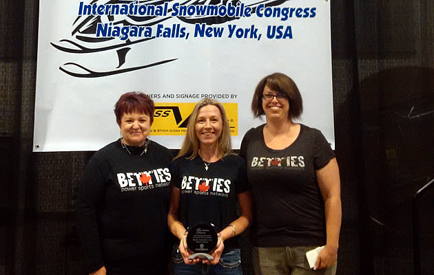 Donegal Wilson and two other ladies from the Betties Power Sports Network accepting an award. 