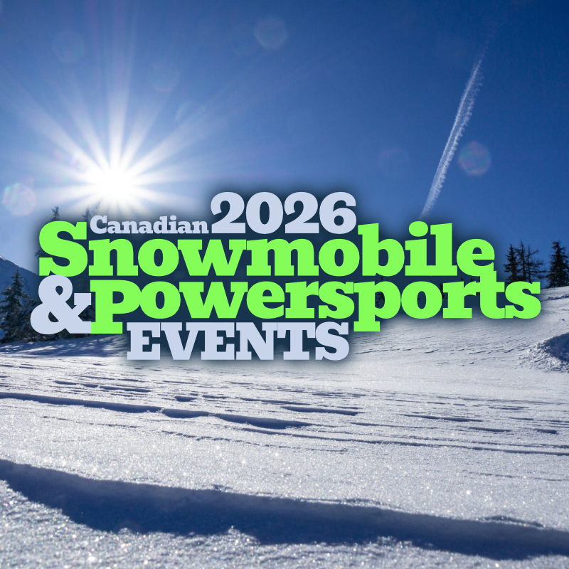 riders getting ready to head out in the snow on sleds