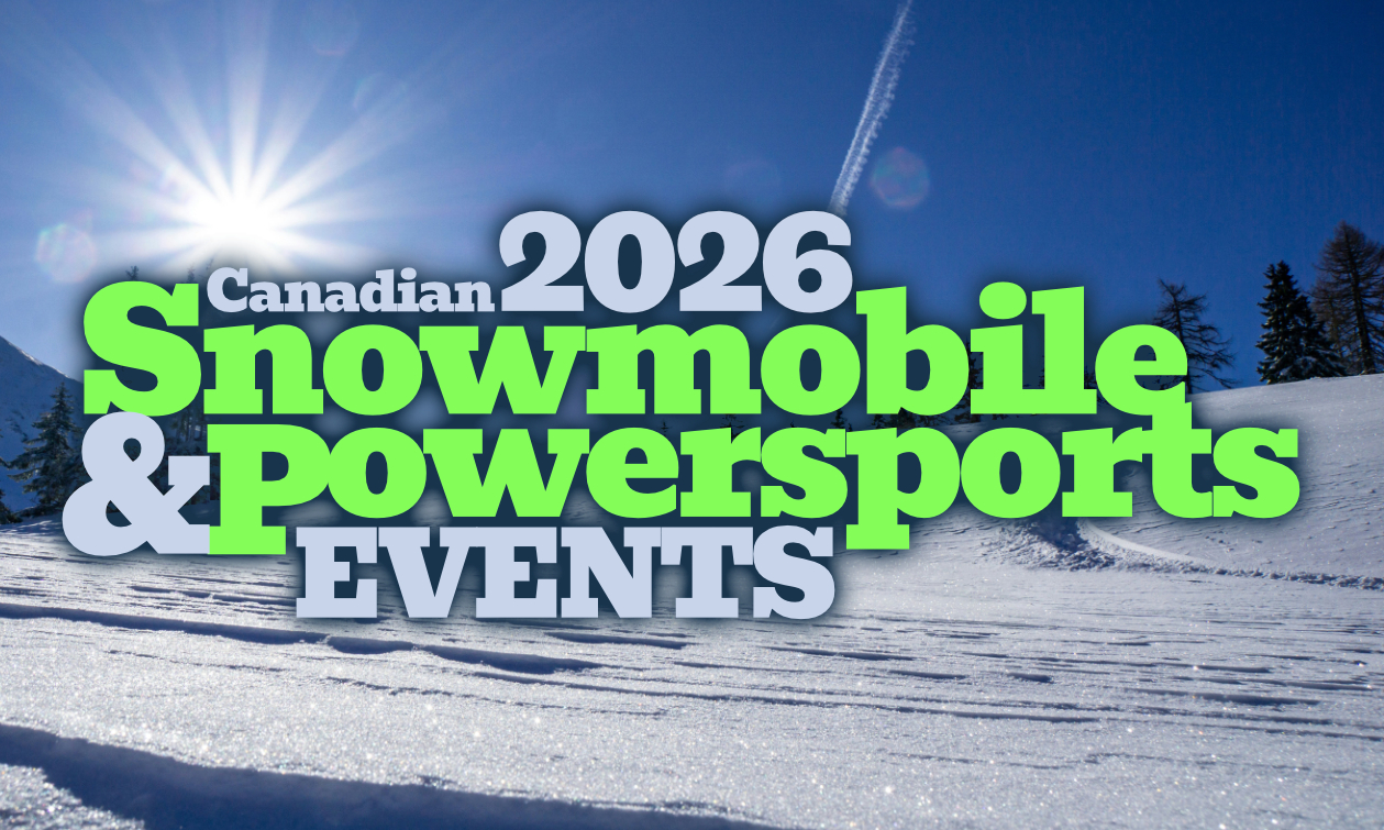 riders getting ready to head out in the snow on sleds