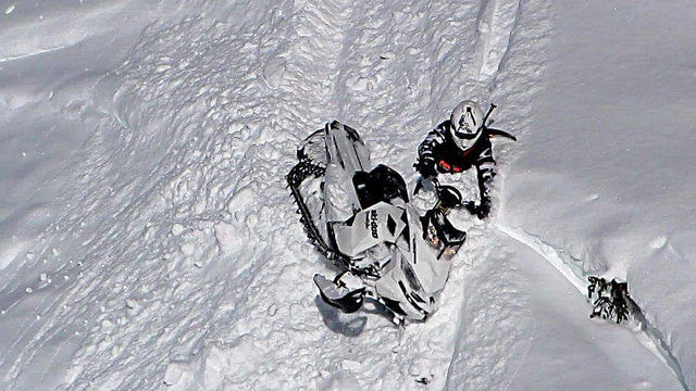 Travis Dauvin in a downhill elevator off a steep ravine in Valemount, BC. 