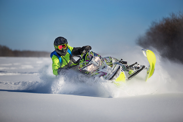 Michael Fidek riding through powder 