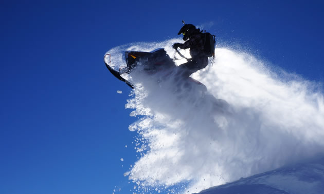 Cody Lumax taking a jump on his sled. 