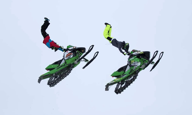 Josh Penner and Brett Turcotte in the air at the Penner Compound. 