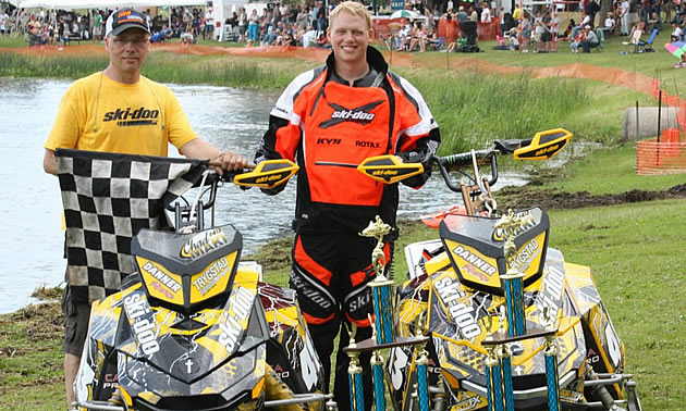 A photo of Mark and Chad Maki with trophies. 