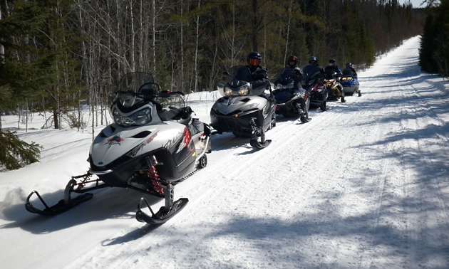 Snowmobilers on the trails near The Pas, Manitoba. 