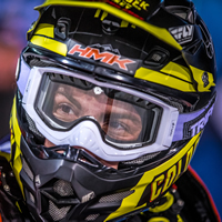 Sam Rogers backflipping a snowmobile. 