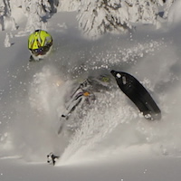 A Ski-Doo XM parked in an open meadow. 