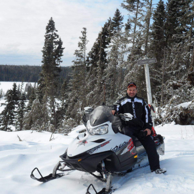 Trevor Schell poses on his snowmobile in Smeaton, Saskatchewan