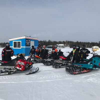 A group of Flin Flon riders gather at a checkpoint on Trail 400 at the recent Frozen Aces Poker Derby. 