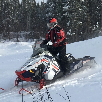A few snowmobilers stop for a break in Hudson Bay, Saskatchewan.