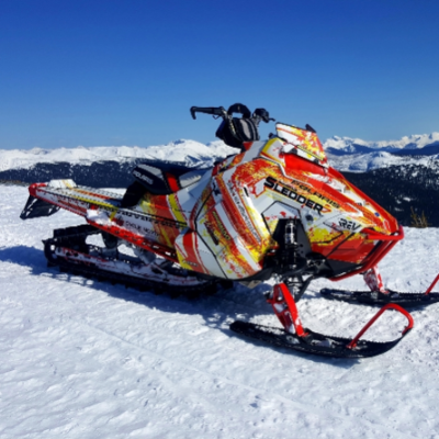 A red and white Polaris Axys 800 RMK. 