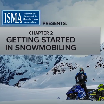 Snowmobilers converse before heading out for a trip.