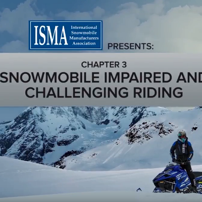 Snowmobilers converse before heading out for a trip.