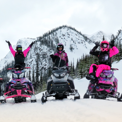 Brittney Dickson (on left) takes some women out for a ride during one of Stay Wild Backcountry Skills’ Ladies Sled Shred Camps. 