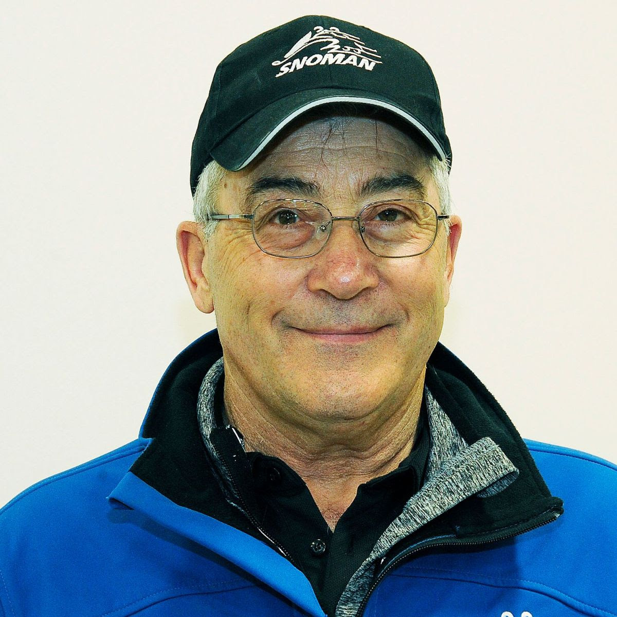 Wayne Vandersteen wears a Snoman hat and blue jacket.