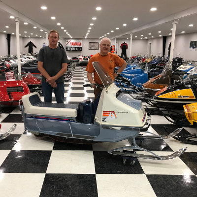 (L to R) Lorne Larson and Valdi Stefanson, president of the America Vintage Snowmobile Association, pose with a 1966 prototype Evinrude Sail Master, which got kiboshed because the public didn’t like the name. 