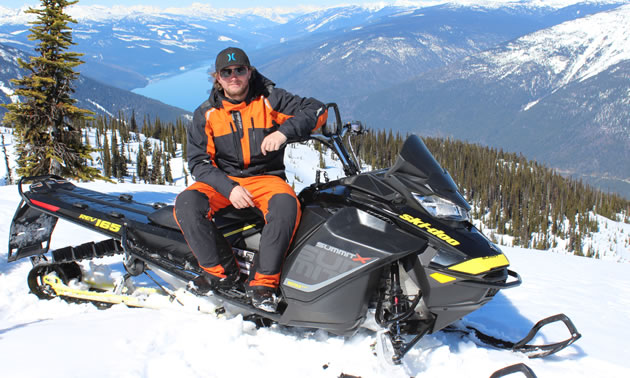 Sean Maxwell poses on his sled above Valemount. 