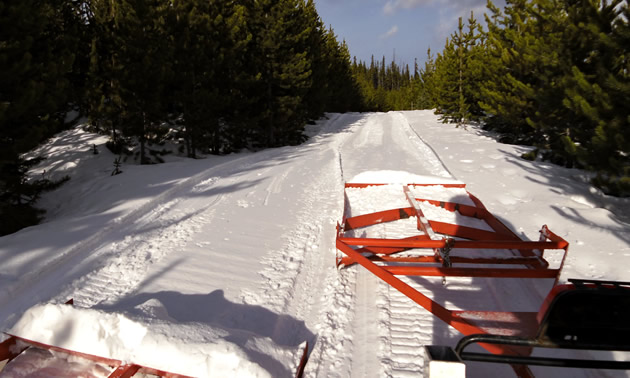 Grooming snowmobile trails in Cataract Creek