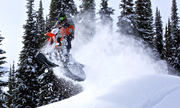 Jeff Rozzy Rosner from Team Thunderstruck takes a jump in the snow on the Yeti snow bike. 