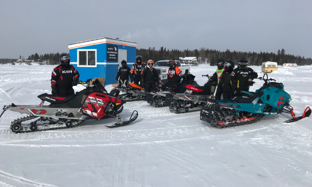 A group of Flin Flon riders gather at a checkpoint on Trail 400 at the recent Frozen Aces Poker Derby.