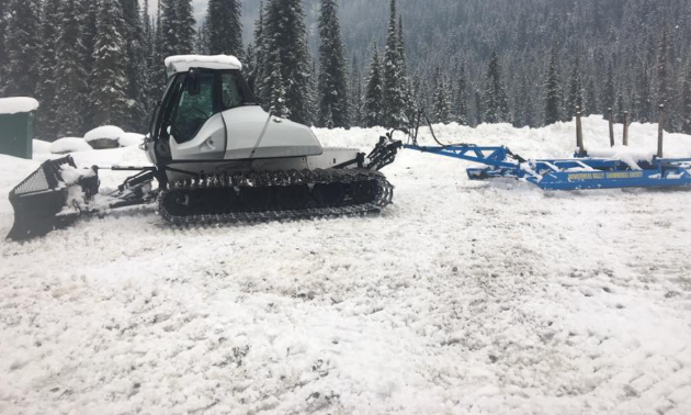 A 2011 Prinoth Bison Snow Cat clears a path for snowmobiles.