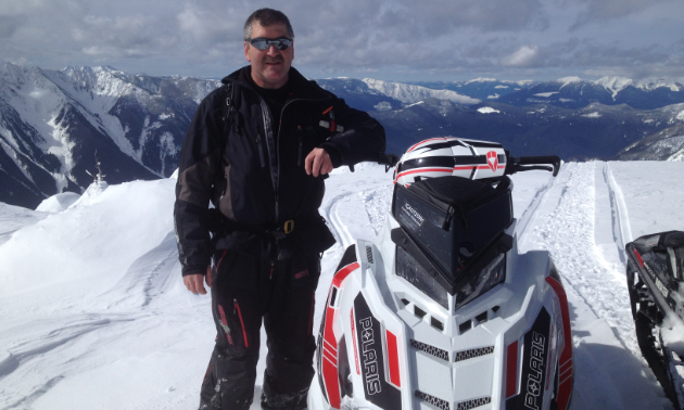 Mark Aeichele stands next to his 2016 Polaris Axys in Kuskanax Valley.
