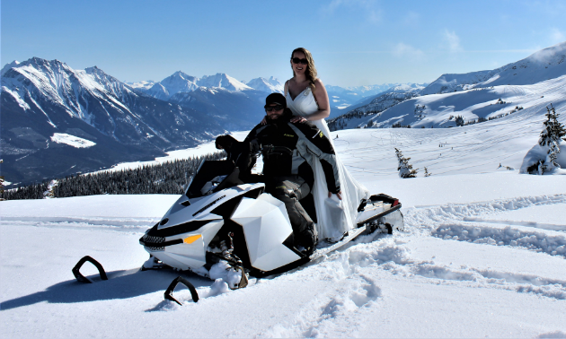 Mitch and Angie Lepage sit on a 2012 Ski-Doo Freeride for their wedding at Clemina in Valemount, B.C.