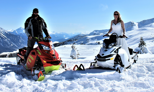 Mitch Lepage stands on a 2016 Ski-Doo Freeride and Angie stands on a 2012 Ski-Doo Freeride for their wedding at Clemina in Valemount, B.C.