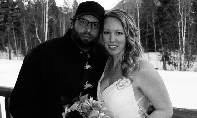 Mitch and Angie Lepage lean in to each other in a black and white photo.