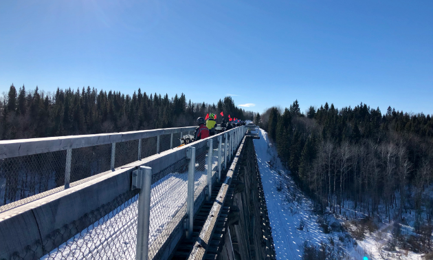 A large bridge fills a great gap in a trail