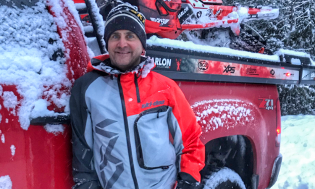 David Norona smiles next to his truck.