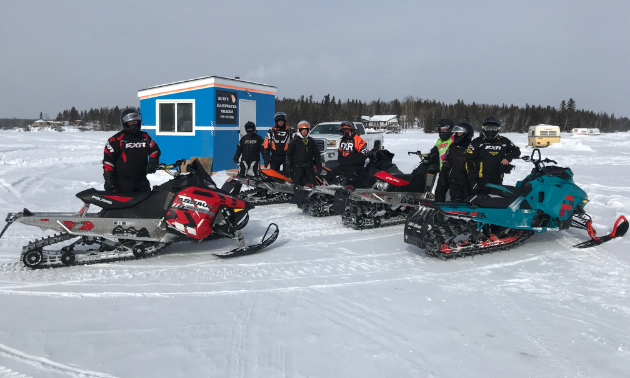 A group of Flin Flon riders gather at a checkpoint on Trail 400 at the recent Frozen Aces Poker Derby. 